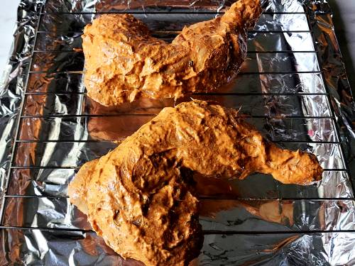 marinated chicken on a wired rack