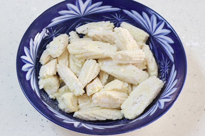 tossing in flours for baby corn manchurian recipe