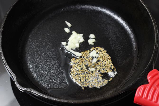 saute cumin for paneer bhurji sandwich