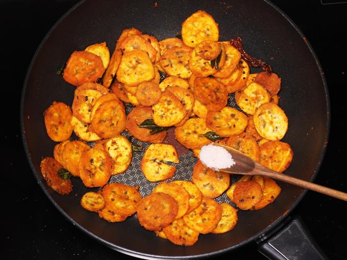 Sprinkle salt to make vazhakkai poriyal
