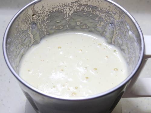 runny almond mixture in a blender