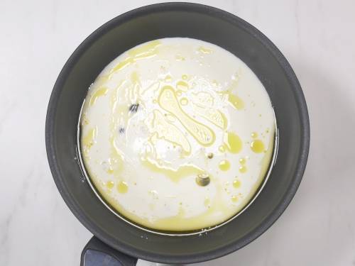 milk and ghee in a pan