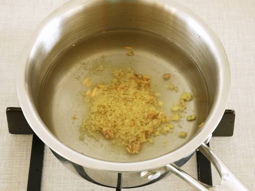 grated ginger and water in a pot
