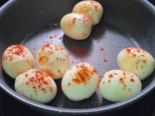 frying the boiled eggs